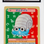 Omanyte 138 Topsun 1st Print Blue Back - 1997 Pokemon - CGC 8